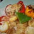Töltött paprika krumpliágyon csőben sütve
